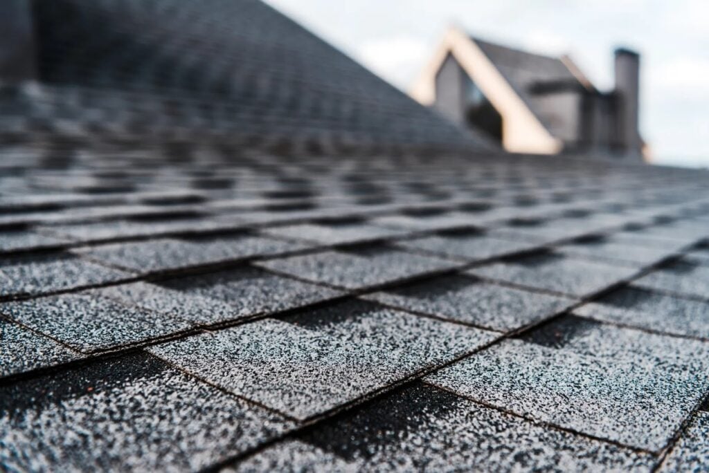 Close-up view of durable asphalt shingles on a residential roof, illustrating a roofing material well-suited for Tampa’s heat, humidity, and heavy rain.
