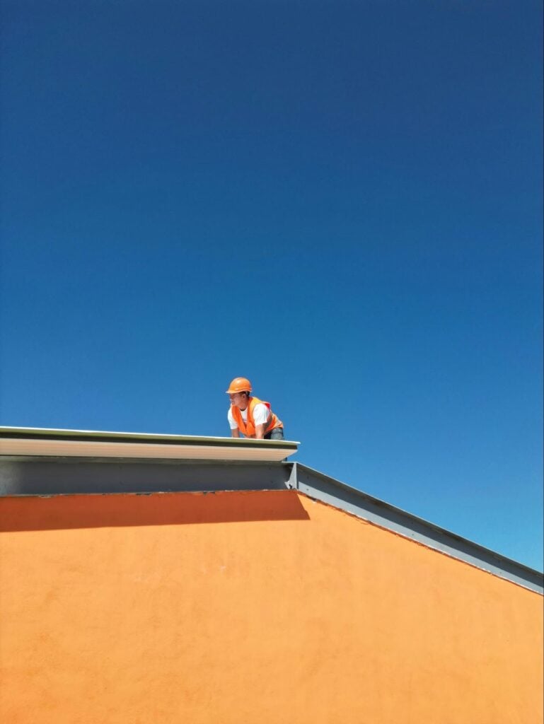 Roofing professional inspecting a rooftop, representing GenX Roofing services in Tampa including roof inspections, repairs, installations, and maintenance. Roofing professional inspecting a rooftop, representing GenX Roofing services in Tampa including roof inspections, repairs, installations, and maintenance.