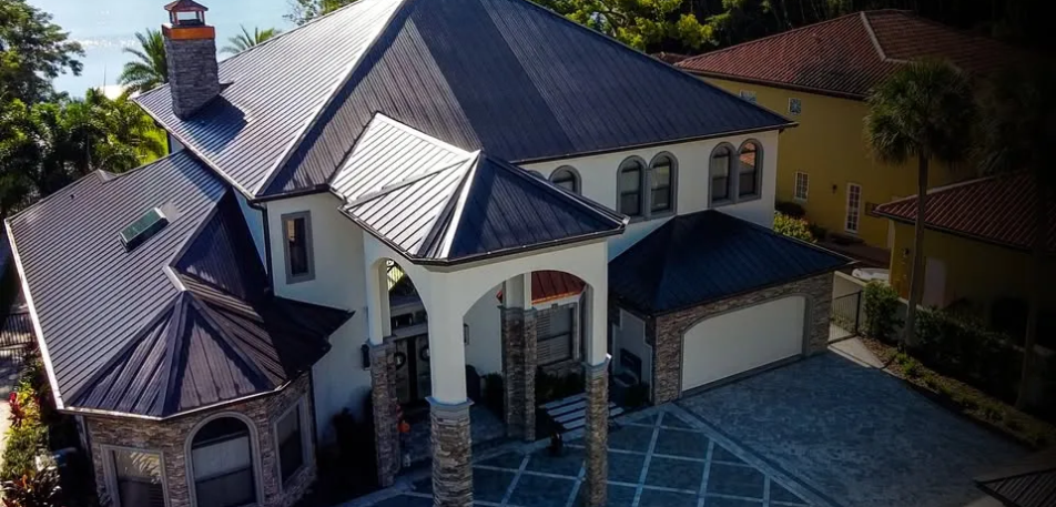 Large home with a durable metal roofing system, illustrating how professional roofing solutions can enhance property safety and long-term protection.